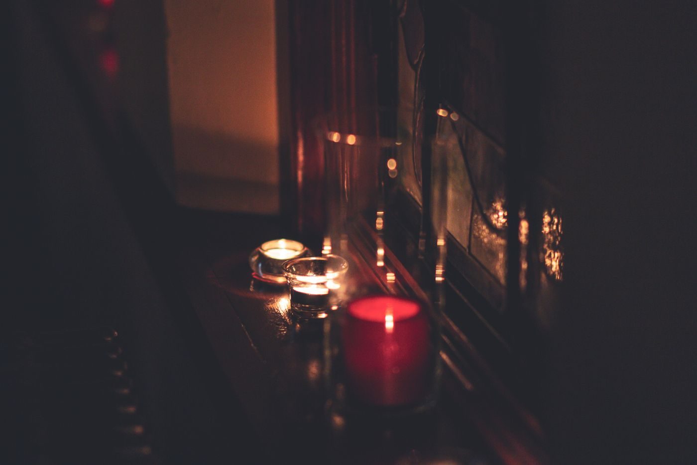 Dark room lit only by candles during a power cut